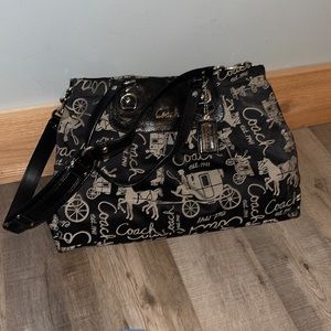 Coach Black and Tan shoulder or handbag. Sizing: 16”W x 11” H x opening 10”.